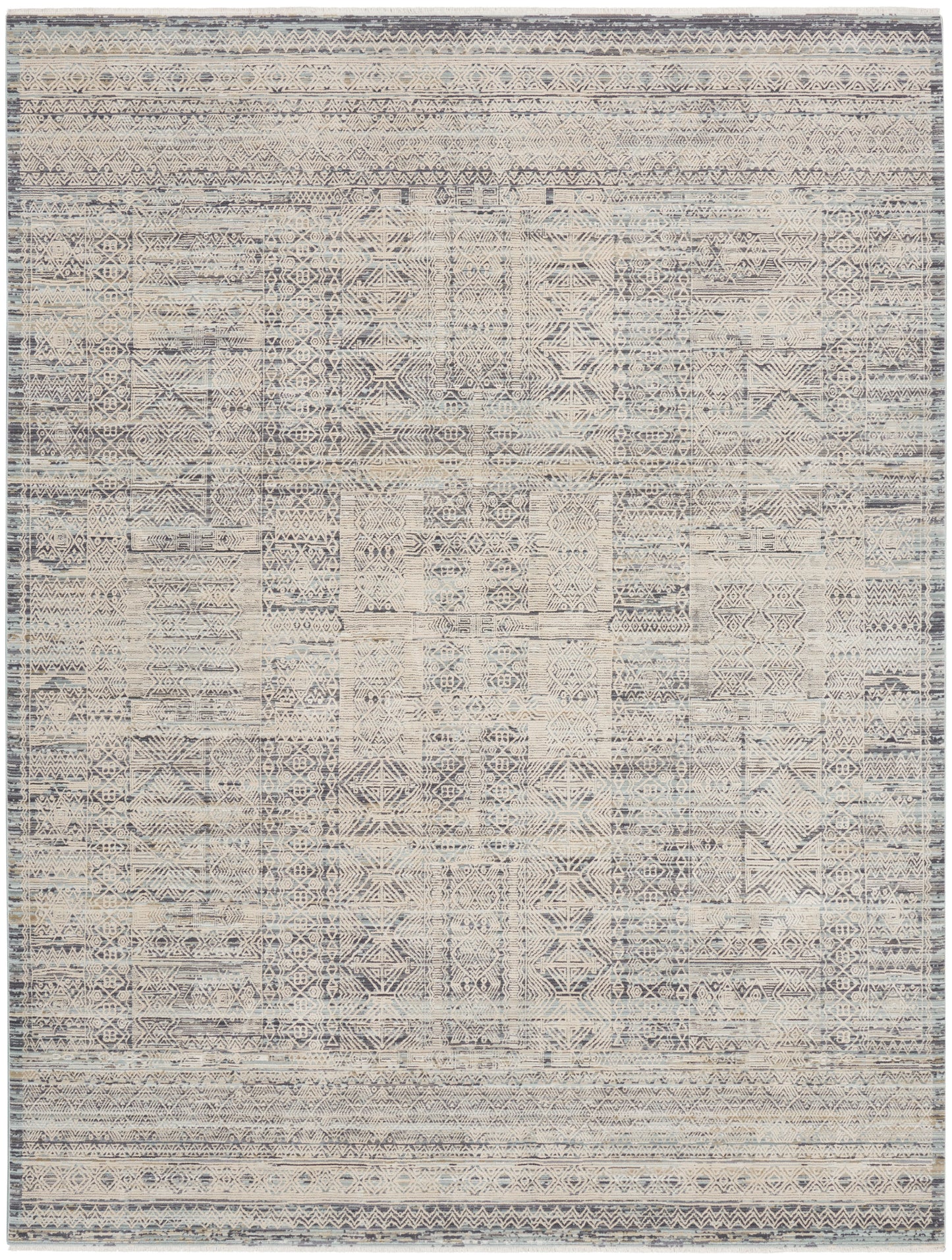 Distressed geometric area rug in ivory & blue-gray with patchwork diamond motifs & bordered edges.