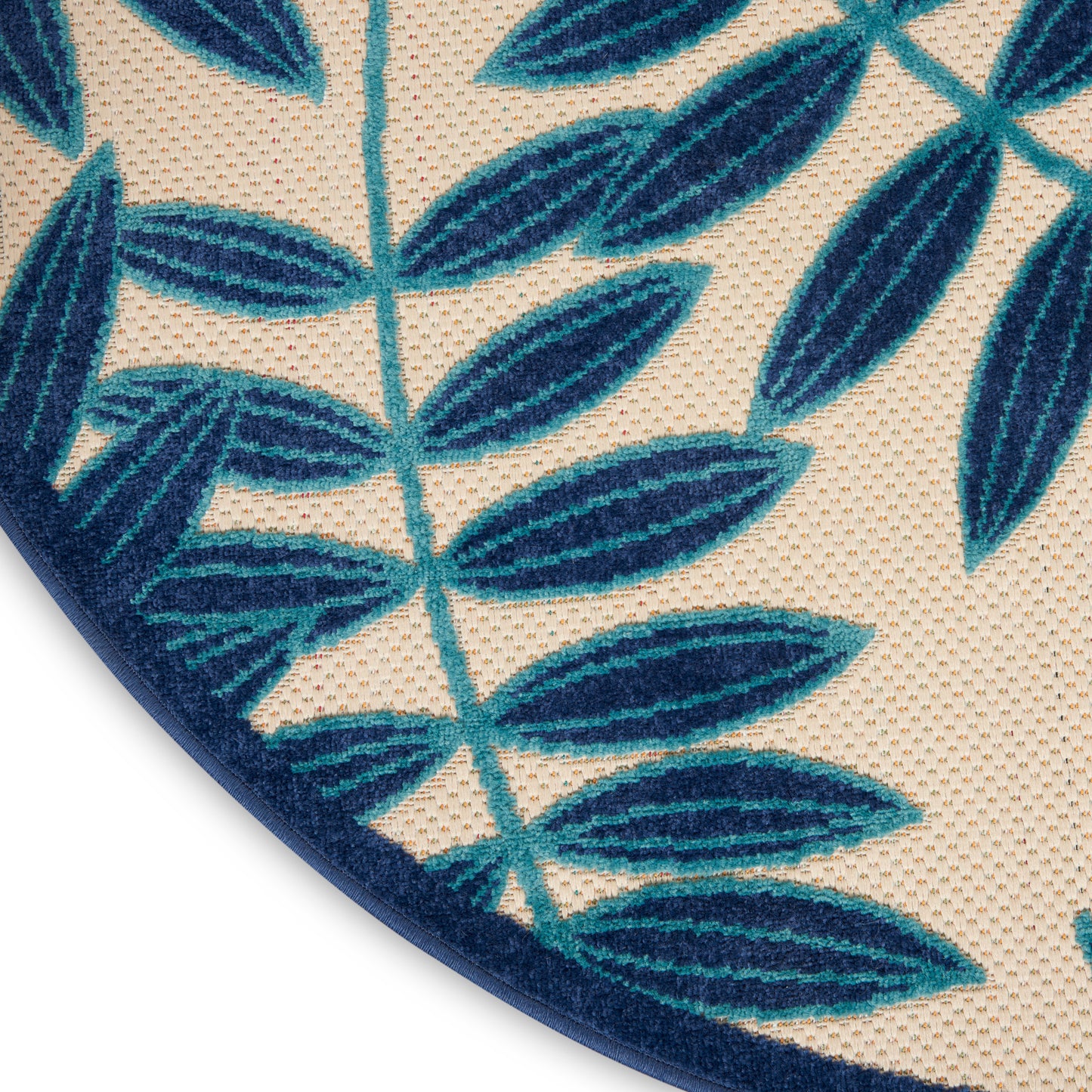 Round rug with teal palm-leaf print on beige background, 4 ft diameter.