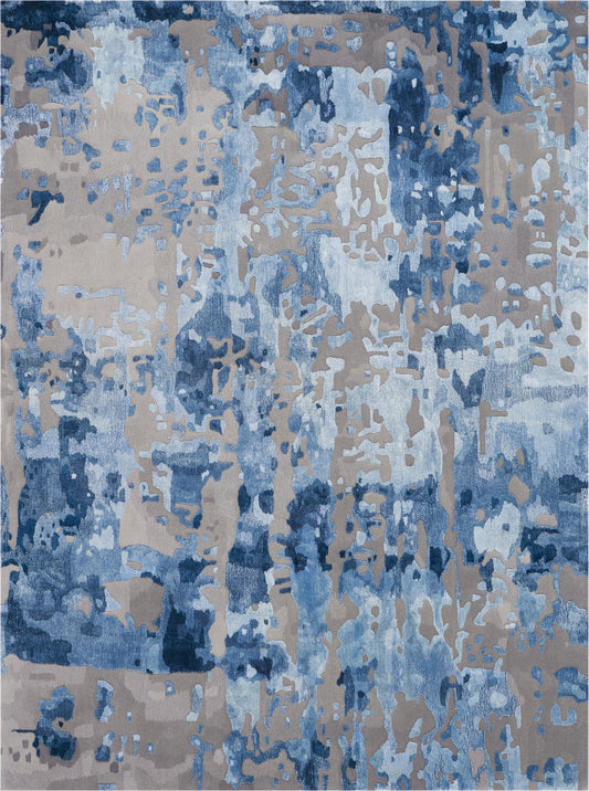 Abstract blue and beige area rug with irregular motif; modern contemporary decor for living room.