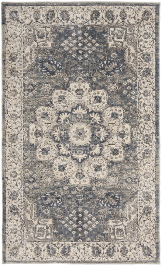 Blue-gray oriental rug with ivory border and central floral medallion; traditional Persian style, for living room.