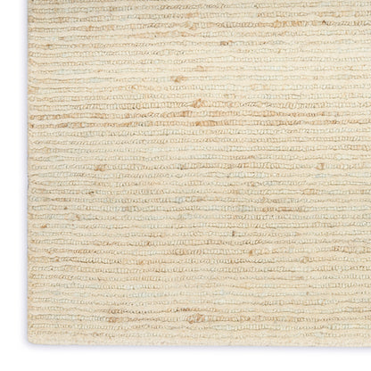 Cream beige looped-pile rug texture with soft, natural woven fibers.