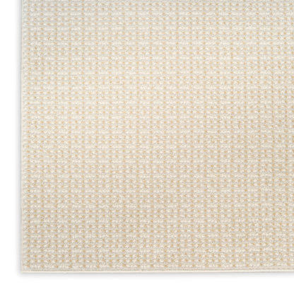 Beige woven rug with subtle cream grid texture and light border, rectangular, cozy modern living room mat.