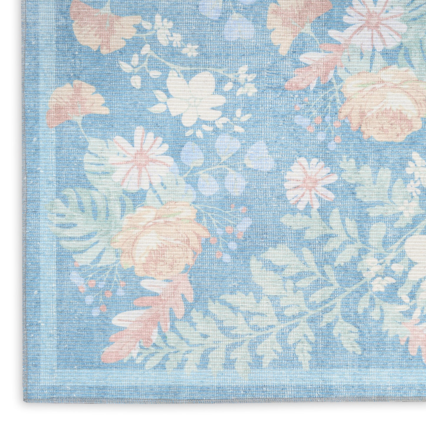Pastel blue floral rug with pink and white blossoms, green leaves, linen-like weave, and decorative border.