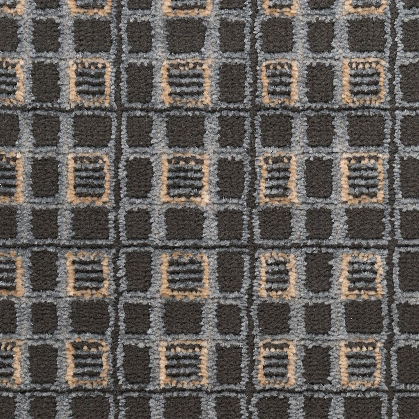 Dark charcoal rug with a gray grid pattern and beige outlined squares in a geometric repeating motif.