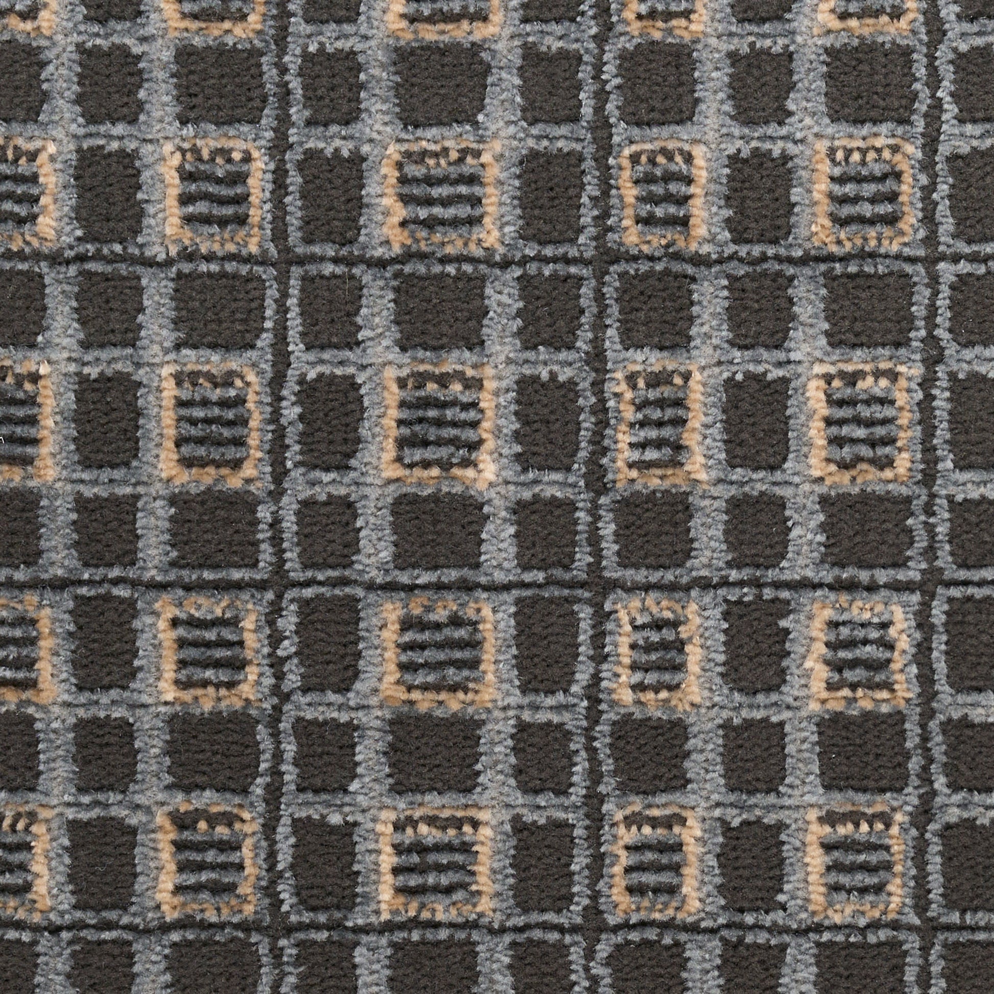 Dark charcoal rug with a gray grid pattern and beige outlined squares in a geometric repeating motif.