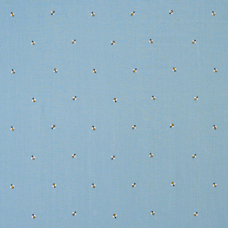 Light blue fabric with tiny yellow-and-black bee motifs repeated across the surface.