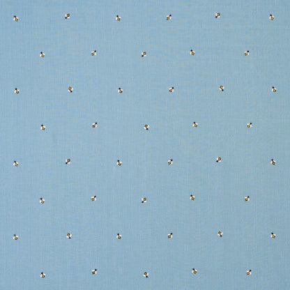 Light blue fabric with tiny yellow-and-black bee motifs repeated across the surface.