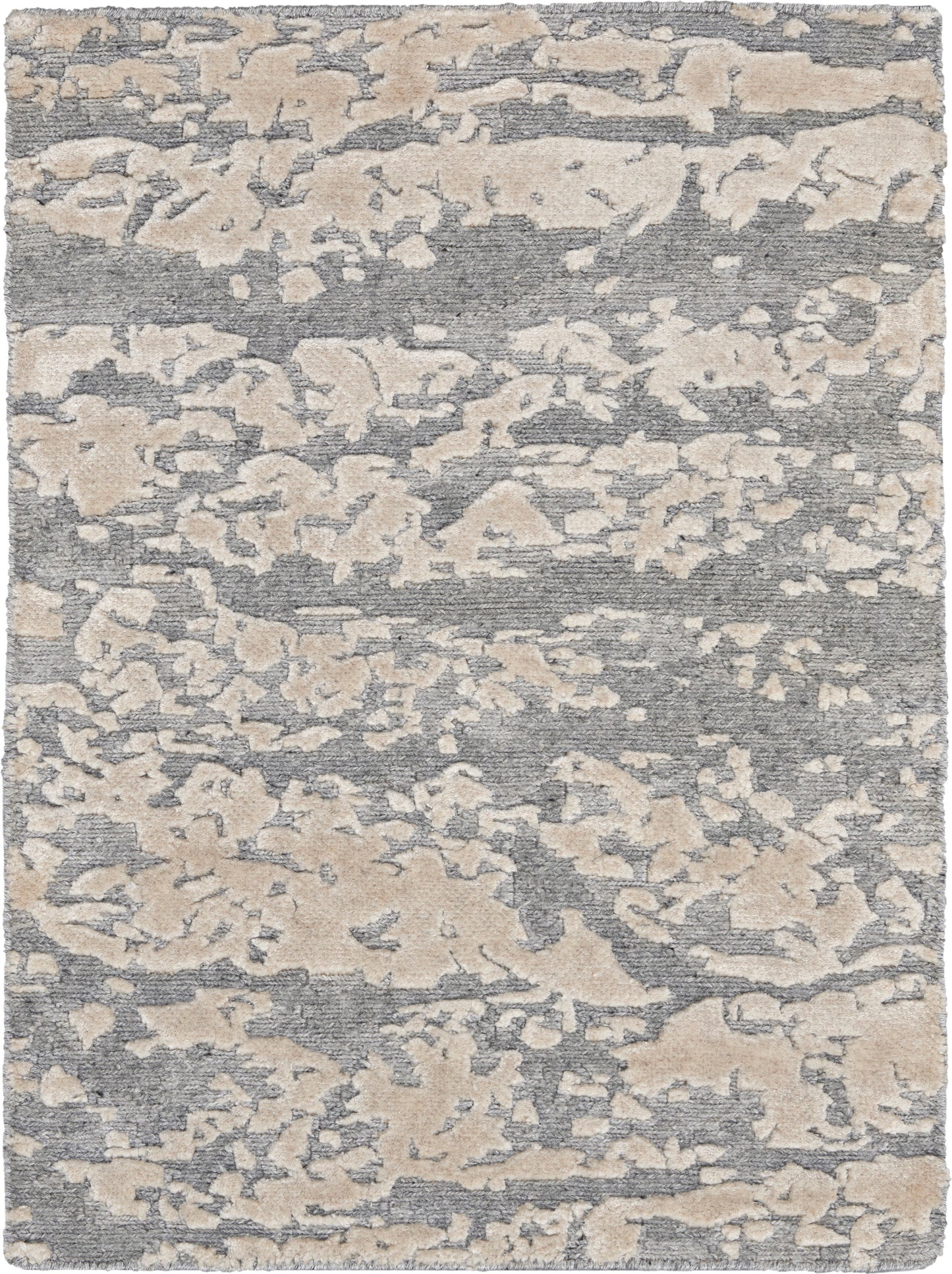 Abstract gray and beige area rug with irregular camo-like pattern; plush woven texture for modern living spaces.