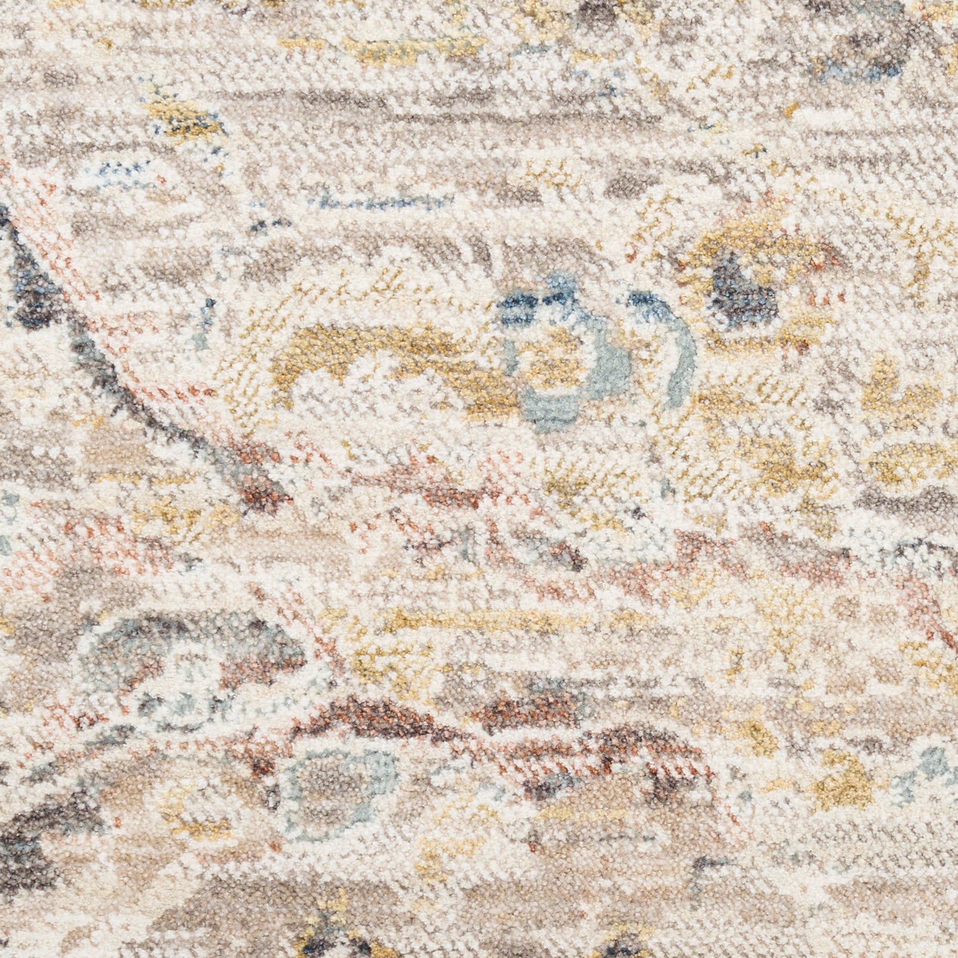 Distressed beige and cream woven area rug with subtle floral motifs in pale blue and yellow; rectangular, cozy living room decor.