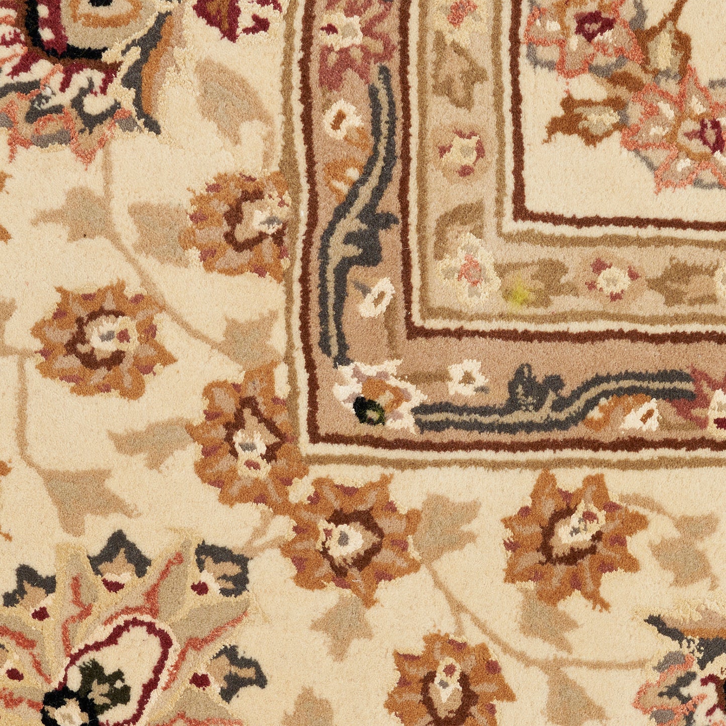 Cream-beige oriental rug with brown and tan floral motifs and layered decorative border.