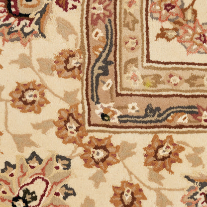 Cream-beige oriental rug with brown and tan floral motifs and layered decorative border.