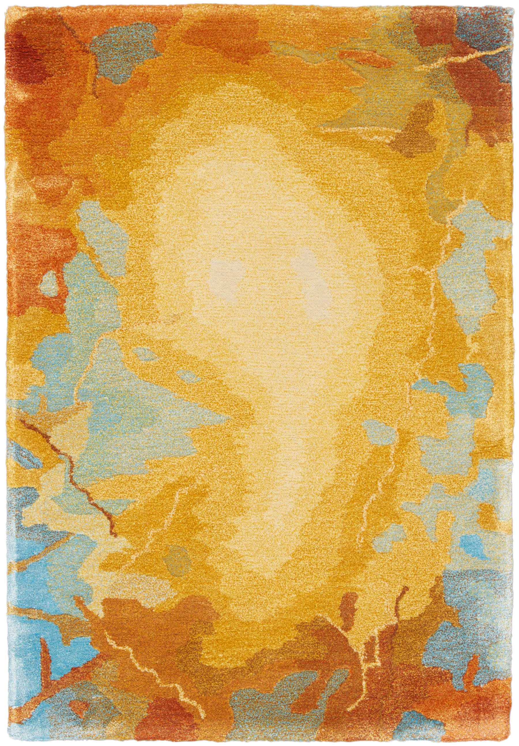 Rectangular plush area rug with warm yellow-orange gradient and blue accents in an abstract sunburst design.