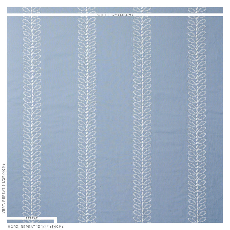 Blue rug with repeating vertical white vine leaf motifs; modern decorative area rug.