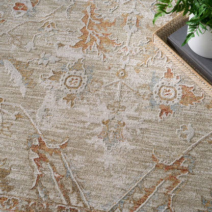 Beige oriental rug with faded blue and rust floral motifs; soft textured natural fiber, beside a woven basket and plant.