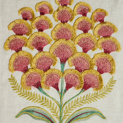 Embroidered pink and yellow mimosa blossoms on cream linen with green stems and fern leaves.