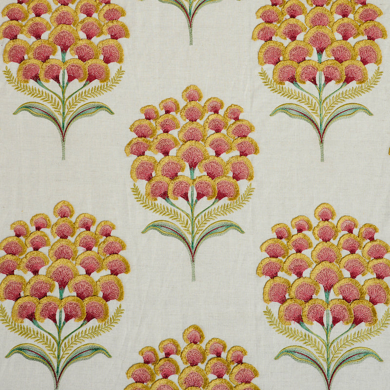 Repeating botanical pattern of pink and yellow pom-pom flowers on green stems with yellow fronds on a cream background.