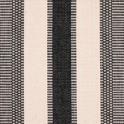 Beige and black hand-woven striped rug with a thick central black stripe and narrow dotted borders.