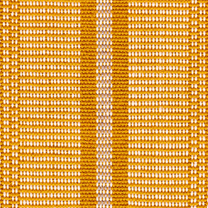 Close-up of orange and white woven fabric with bold orange vertical bands and a white center stripe.