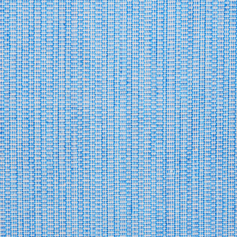 Close-up of blue woven fabric with white threads forming a subtle grid pattern and textured surface.