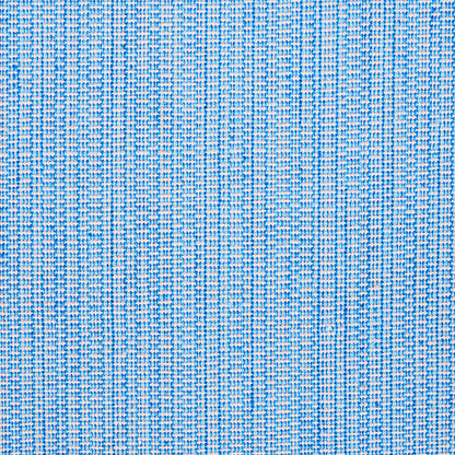Close-up of blue woven fabric with white threads forming a subtle grid pattern and textured surface.