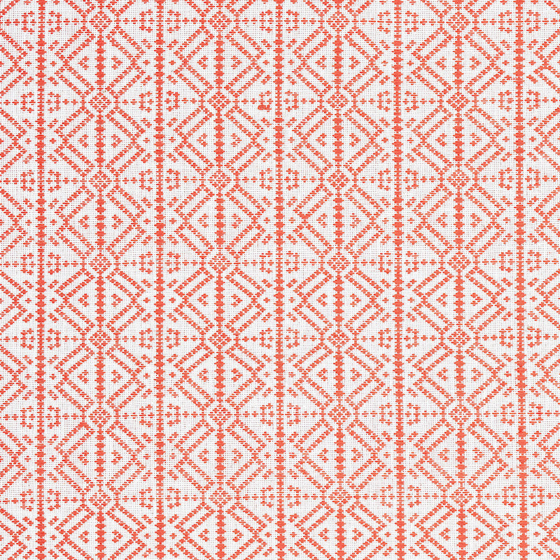 Coral geometric lattice embroidery on white fabric, diamond motifs with dotted lines, ethnic-style textile for home decor.