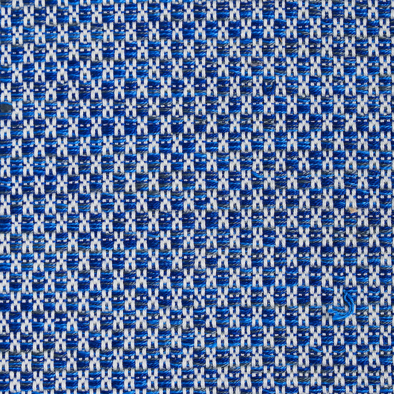 Close-up of a blue hand-woven texture pattern.