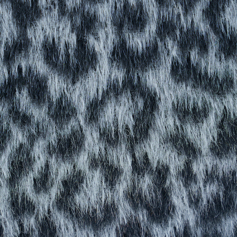 Close-up of grey leopard-pattern woven fabric.