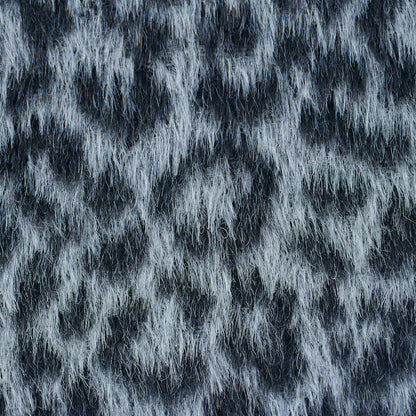 Close-up of grey leopard-pattern woven fabric.