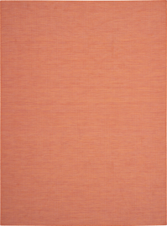 Orange woven rug with subtle grid texture in warm terracotta tones.