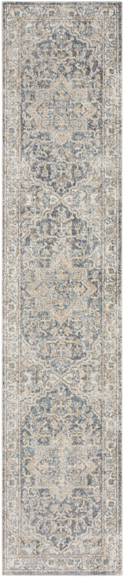 Long rectangular runner rug with distressed blue-gray and ivory Persian-inspired medallion pattern, hallway use.
