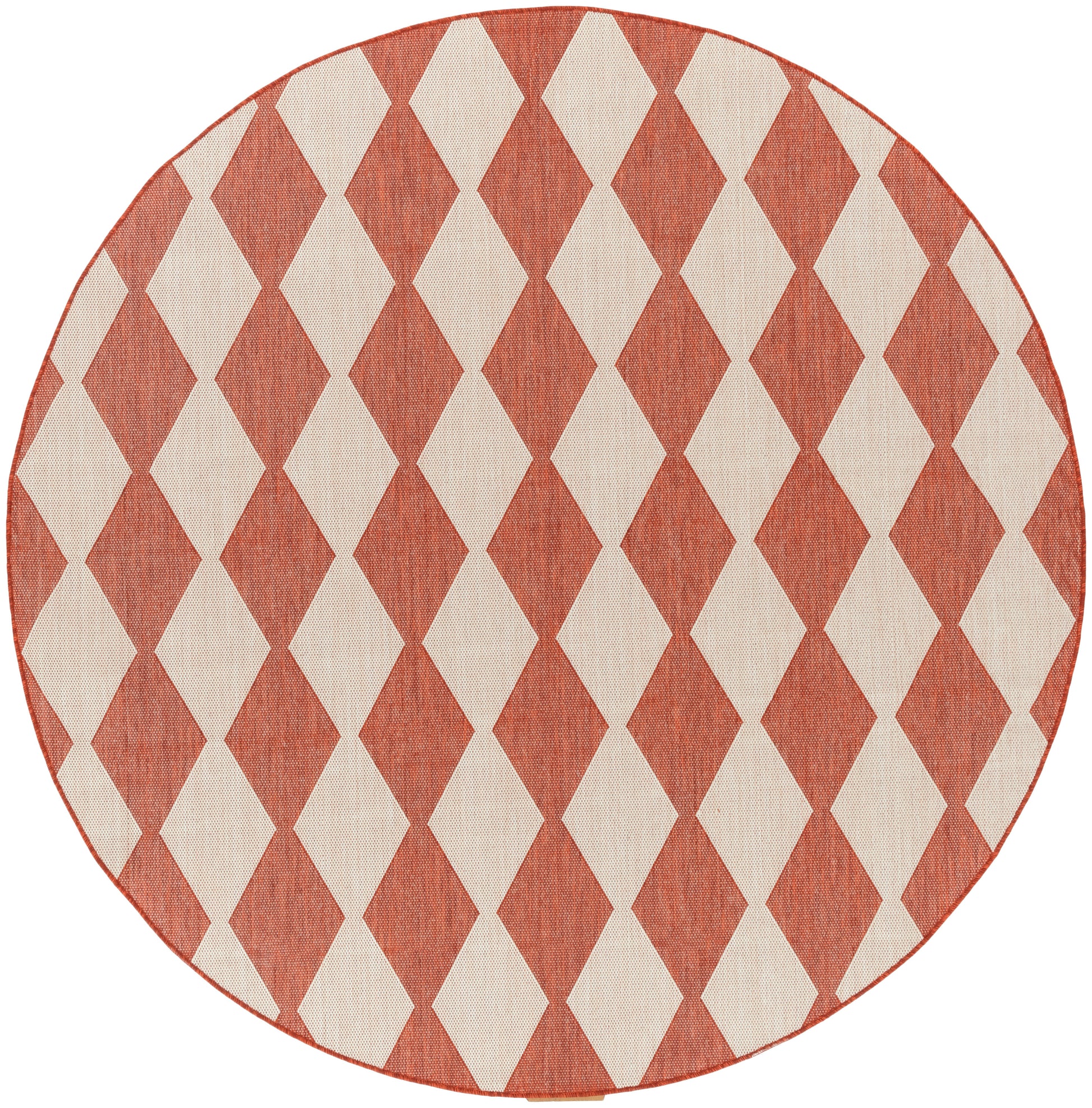 Round rug in rust red and cream diamond harlequin pattern; woven textile with a red stitched edge.