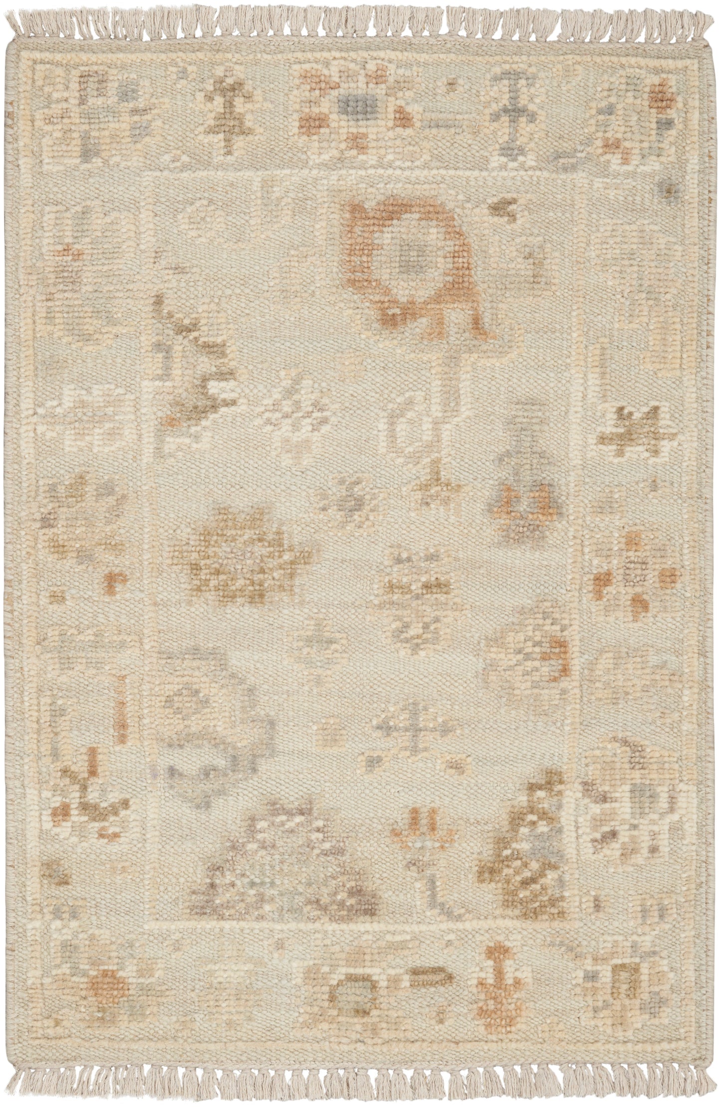 Cream-colored oriental rug with subtle floral-geometric motifs in beige, taupe and peach; fringed ends.