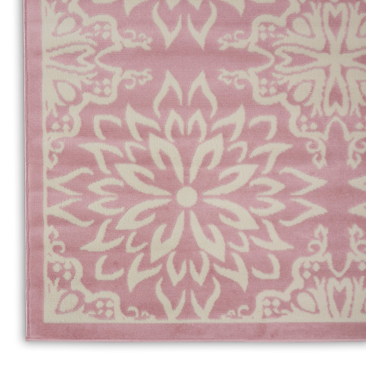 Soft pink rug with ivory mandala motif and pale pink border, 8' x 10'.