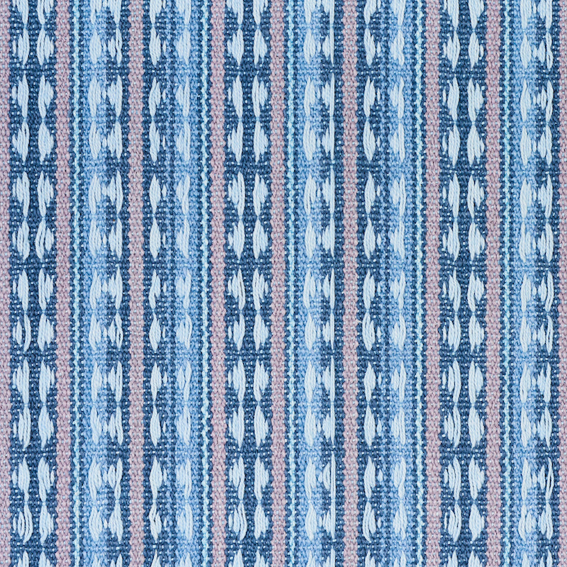 Ikat-inspired woven textile with vertical blue stripes and pale pink accents; geometric leaf motifs.