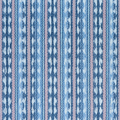Ikat-inspired woven textile with vertical blue stripes and pale pink accents; geometric leaf motifs.