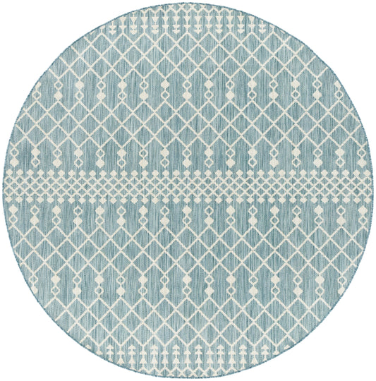 Round teal rug with white geometric lattice pattern, diamond motifs and a woven central band.