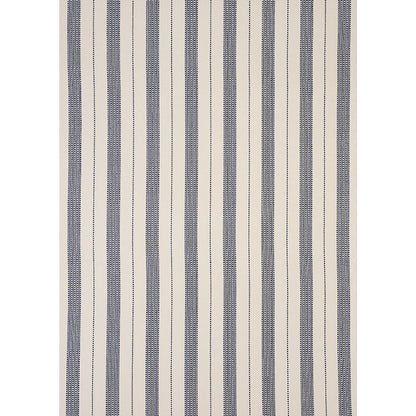 Navy blue and cream striped rug with dotted vertical stripes, woven textile for living room decor.