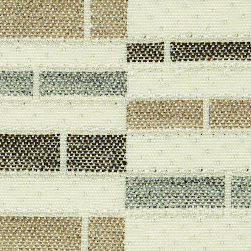 Woven textile rug with cream base and brick-like blocks in beige, taupe, gray, and brown; neutral geometric pattern.