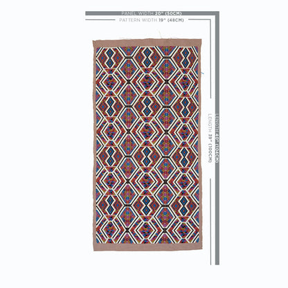 Rectangular woven rug with a red and blue geometric hex/diamond pattern, white accents, and a light brown border.