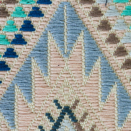 Geometric hand-woven brocade-pattern rug with diamond and triangle motifs in beige, blues and teals; cotton-wool blend.