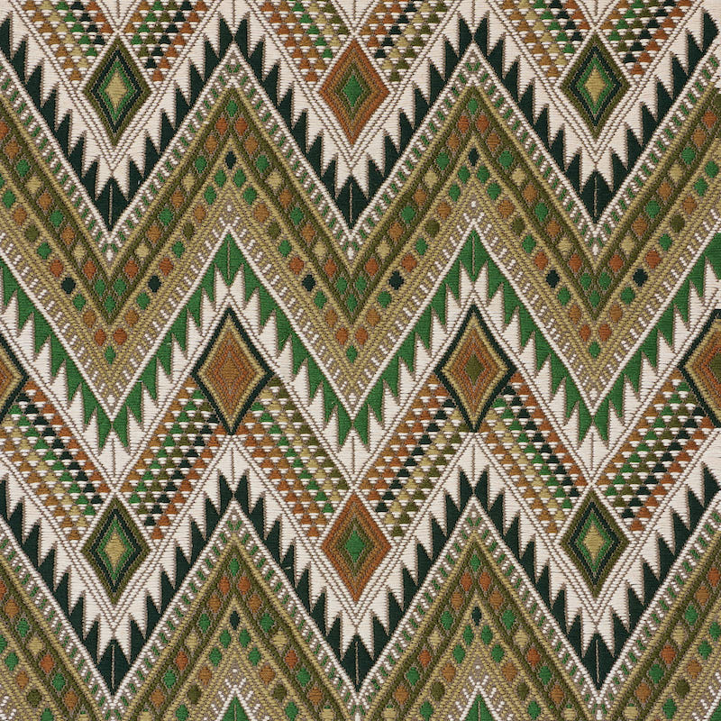 Woven tribal chevron textile with emerald green, olive, tan, beige and black diamond motifs in zigzag pattern.