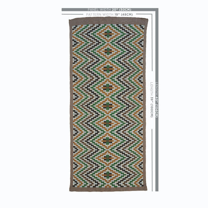 Long kilim-style runner rug with green, orange, brown and black diamond zigzag pattern on white, bordered in brown.