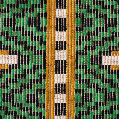 Close-up of hand-woven brocade textile with green, black and white geometric pattern and gold-orange vertical stripes.