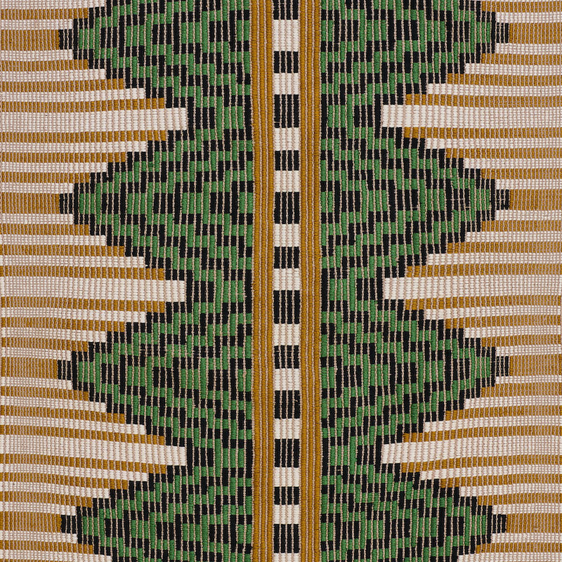 Geometric hand-woven textile with green zigzag diamonds on black and tan-gold background, and a central white-black checkered gold stripe.