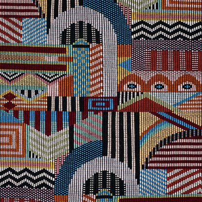 Hand woven brocade-pattern textile with colorful patchwork of geometric blocks, zigzags, stripes and dots in red, blue, black, white and yellow.