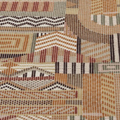 Warm earthy geometric rug with zigzags, chevrons and diamonds in orange, beige, brown, rust and cream; handwoven texture.