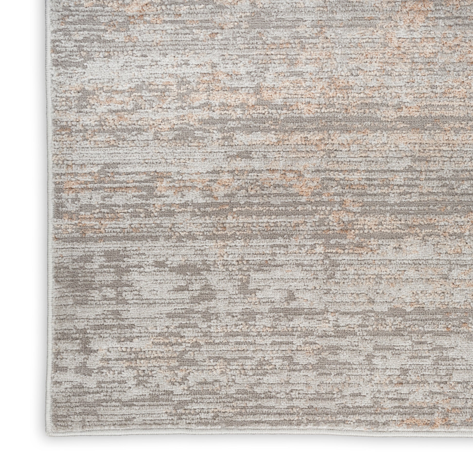 Abstract gray and beige runner rug with subtle orange accents and a light border along the edge.
