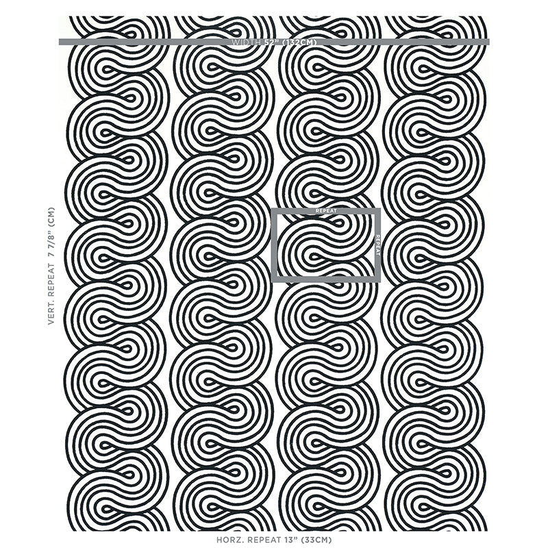 Black & white concentric circle spiral embroidery motif; bold geometric pattern on fabric.