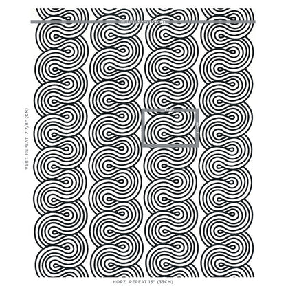Black & white concentric circle spiral embroidery motif; bold geometric pattern on fabric.