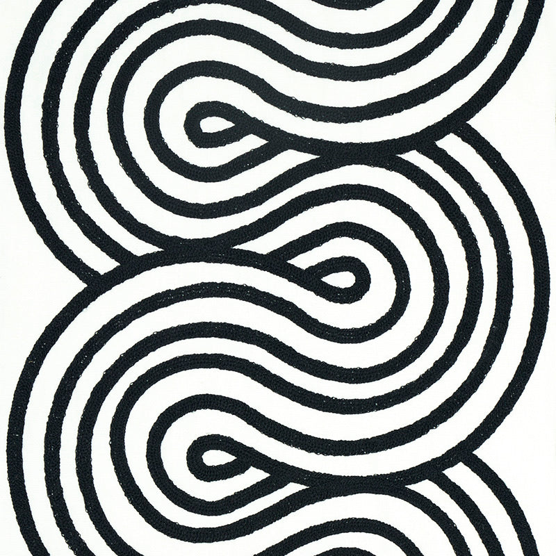 Black-on-white abstract rug with thick looping wavy lines forming a labyrinth pattern; modern decor.